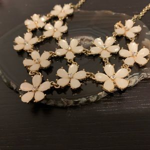 flower necklace. new, not worn. no scratches or sign of wear.